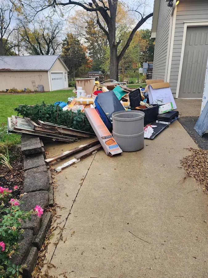 Dumpster being loaded with debris for 30 Yard Dumpster Rental in Belle Fourche